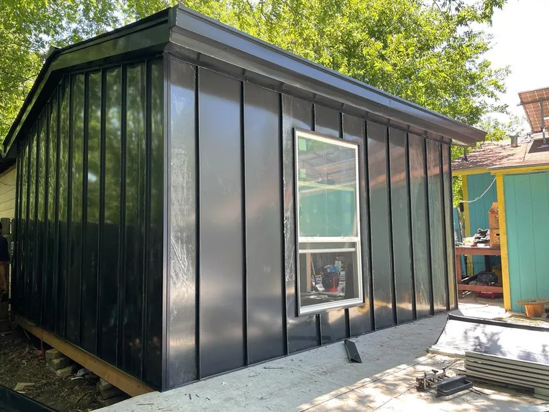 Black standing seam metal wall panels for Roof Inspection in Preston